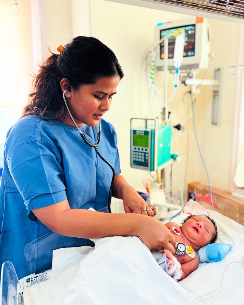 Dr. Aastha Jain checking infant health indicators in incubator
